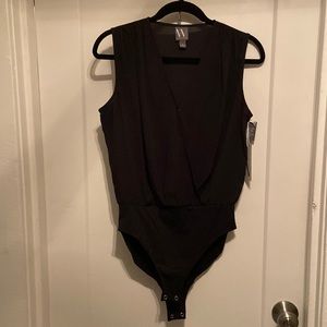 Worthington sleeveless black sheer unitard top with snaps. never worn NWT
